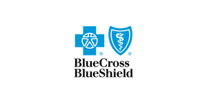 A healthcare symbol featuring a cross, a shield, and medical icons