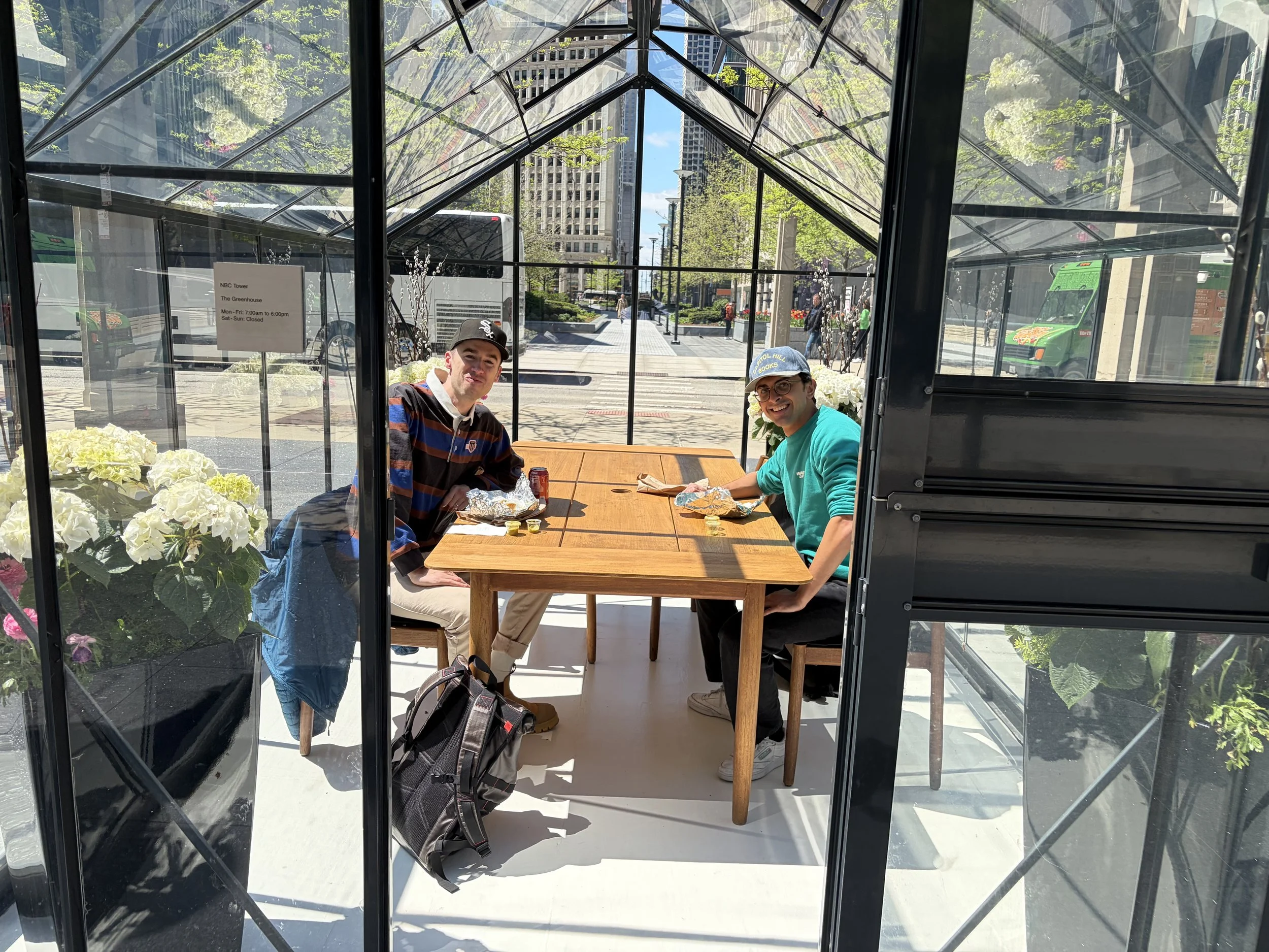 Volunteers and community members sharing a meal outdoors