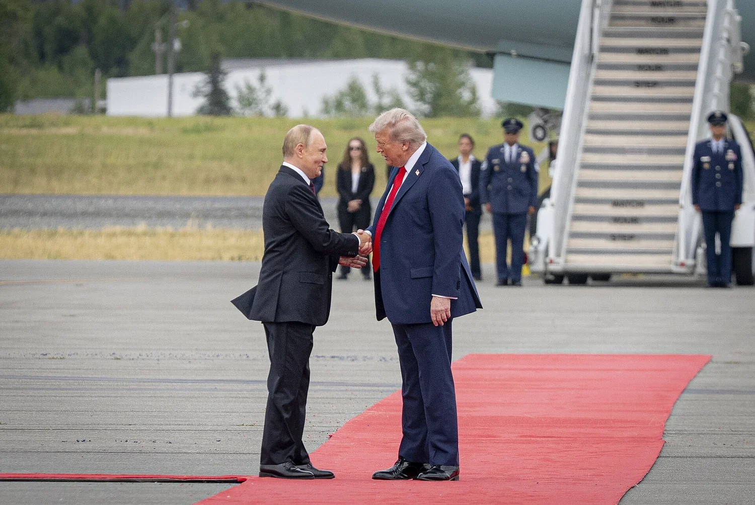 President Donald Trump greets Russian President Vladimir Putin on a red carpet at Joint Base Elmendorf-Richardson, Anchorage, Alaska, Aug. 15, 2025