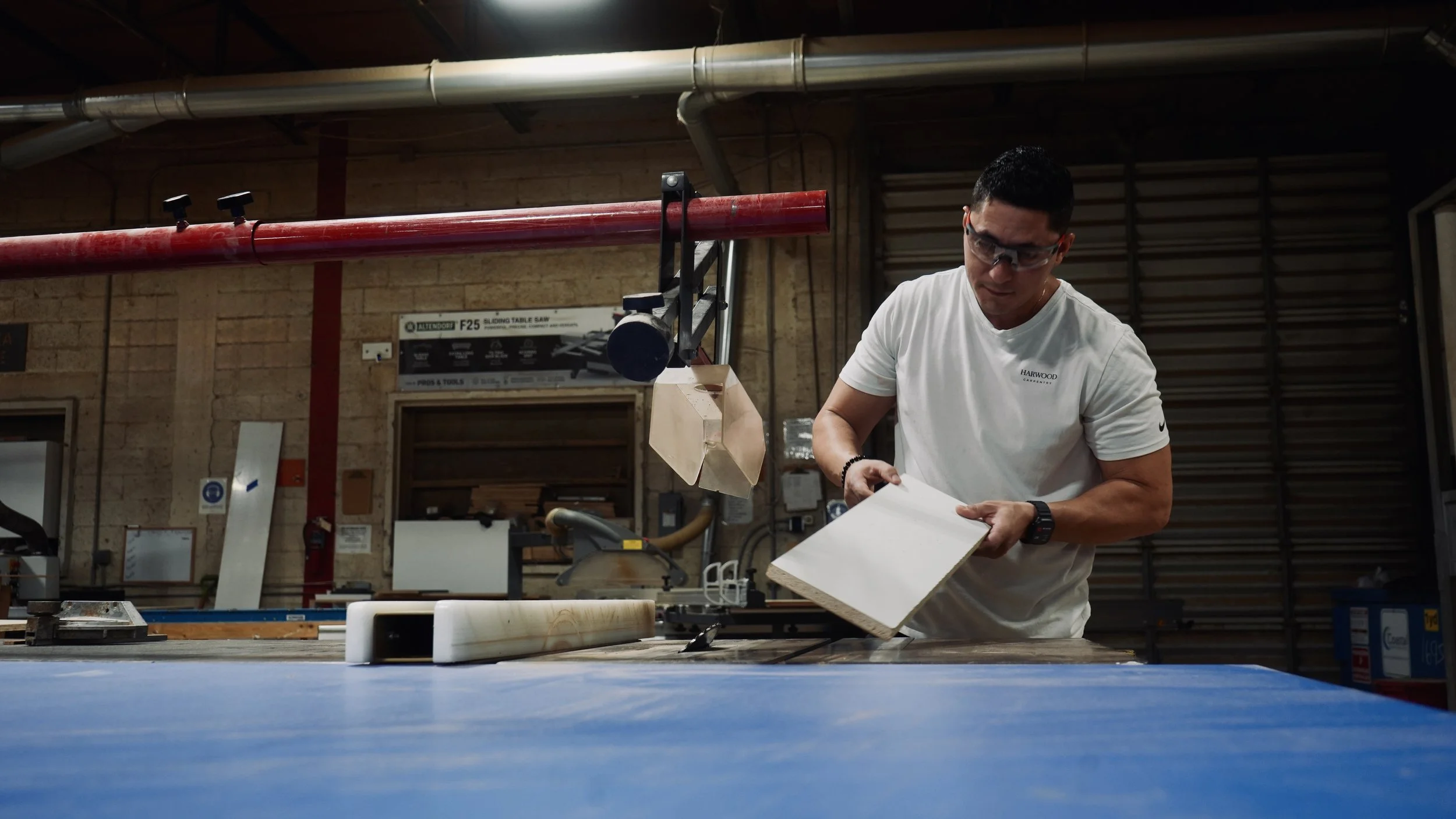 Handry inspecting a cabinet during assembly