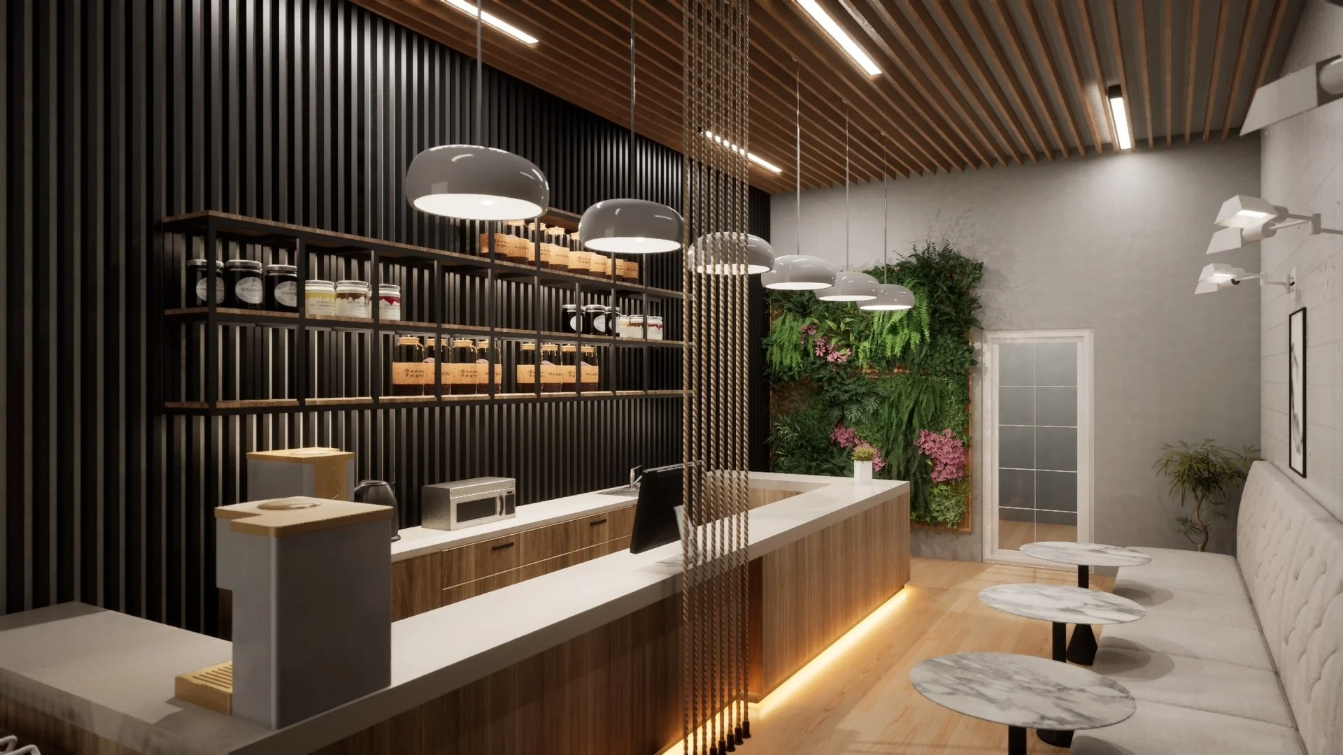 Modern cafe interior with a white countertop, wooden accents, pendant lights, green wall, and seating area.
