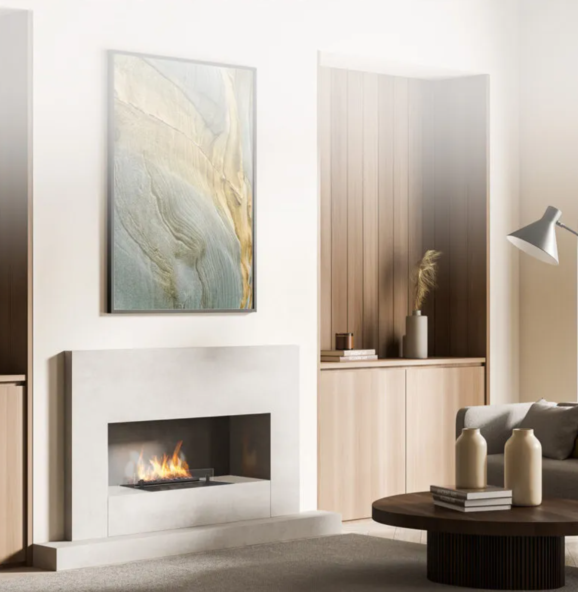 Modern living room with white fireplace, abstract art above, wooden accent wall, beige decorative vases on coffee table, gray couch, and adjustable reading lamp.