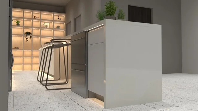 Modern kitchen island with three black barstools, green plants on top, and a built-in oven, with a wall of illuminated shelves in the background.