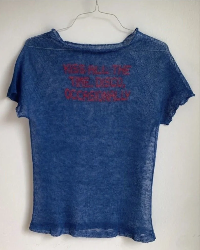 The Artist Behind the Shirt on Harry Styles’ New Album Cover. Beneath a disco ball, Harry Styles wears a blue knit T-shirt by Patrick Carrell, a Los Angeles–based textile artist known for turning knitwear into emotional language.