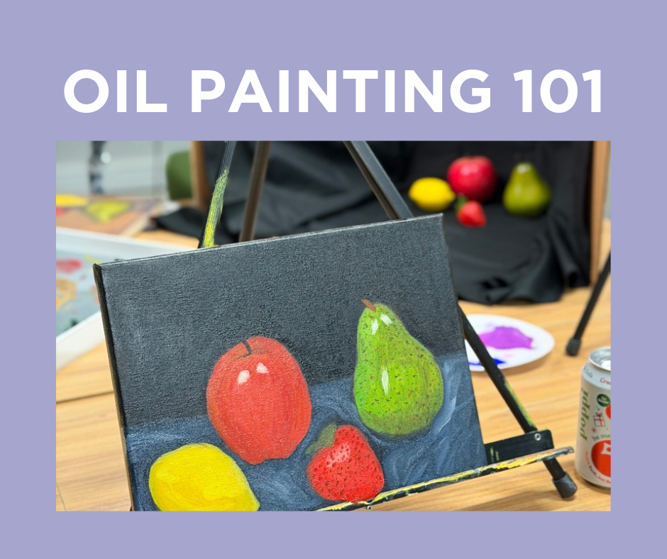 An easel holding a small oil painting of four different fruits, including an apple, pear, lemon, and strawberry, on a table with art supplies and fruits in the background.