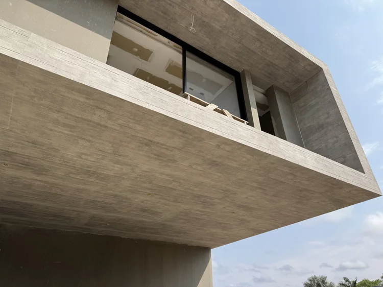 Façade clad in exposed-concrete Wall Skin