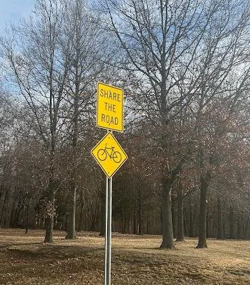 A road sign telling motorists to share the road