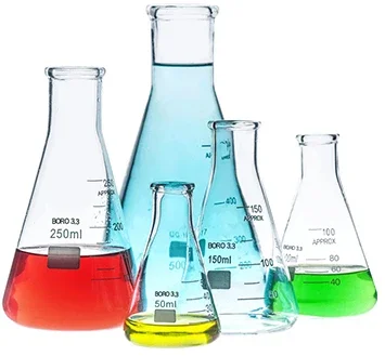 Various laboratory glassware, including beakers and flasks, filled with colored liquids such as red, blue, yellow, and green.