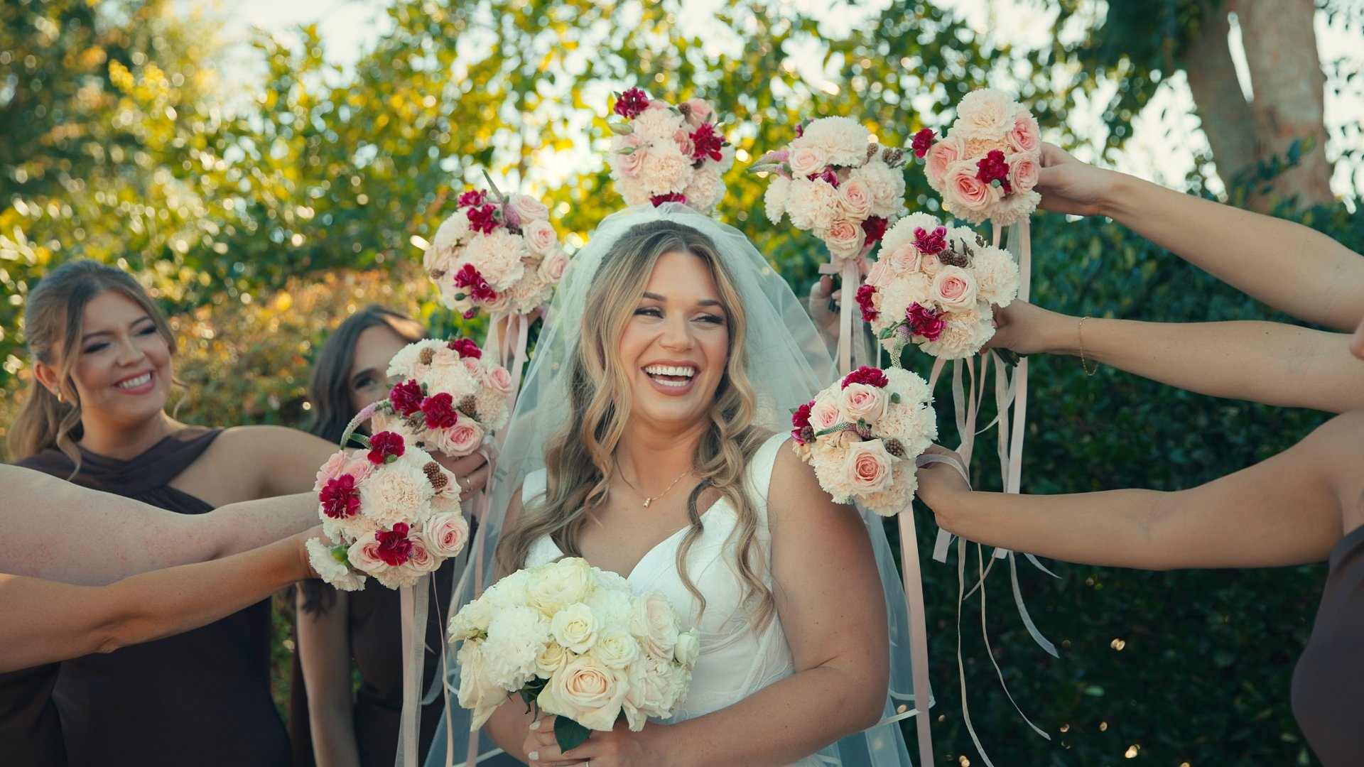 Screenshot of a professioanl wedding video in Murrieta, California of a bride smiling during her photoshoot
