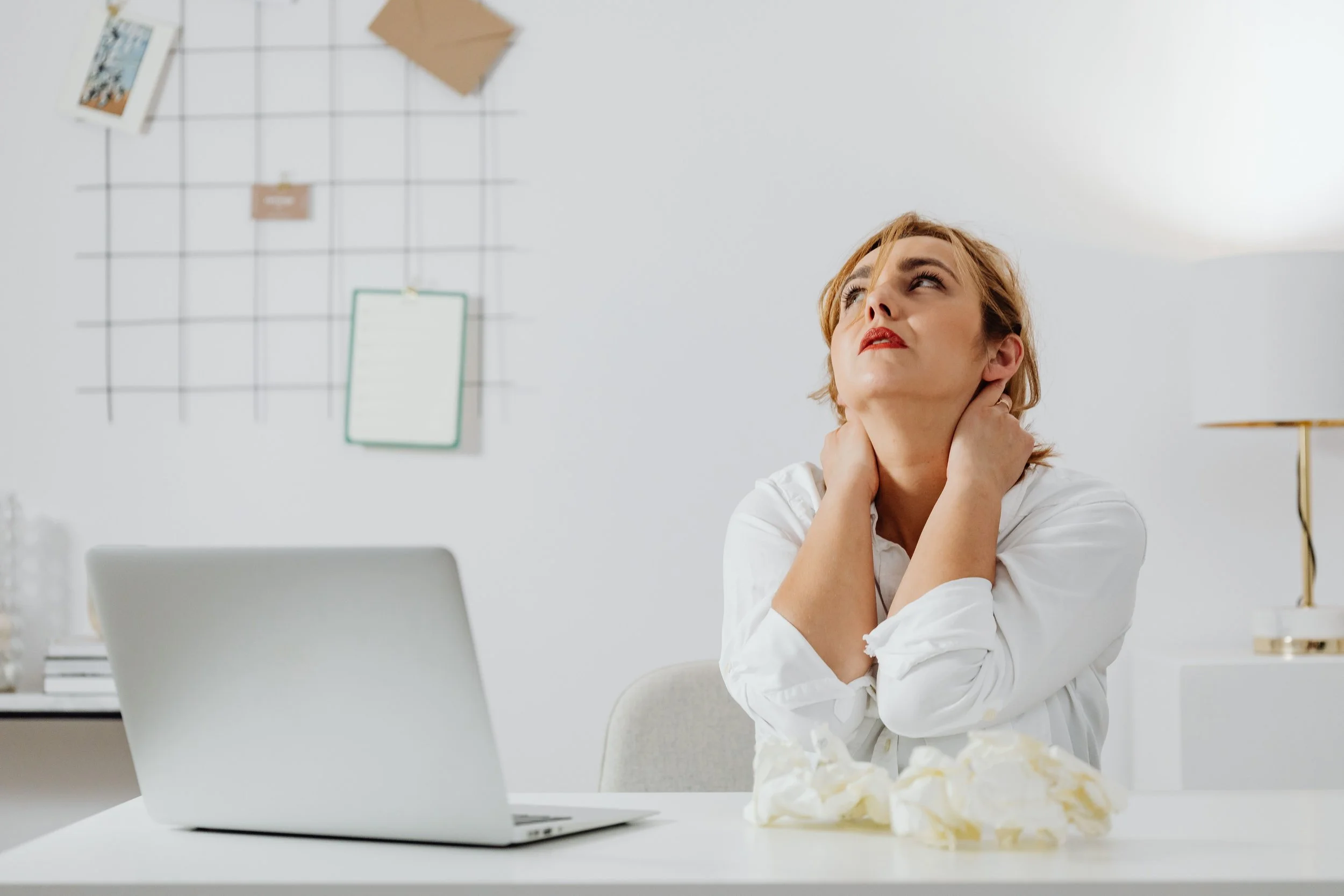 An adult relaxing with a warm cup of tea in a sunlit room, illustrating nervous system regulation and the relief that comes from therapy for stress and burnout.