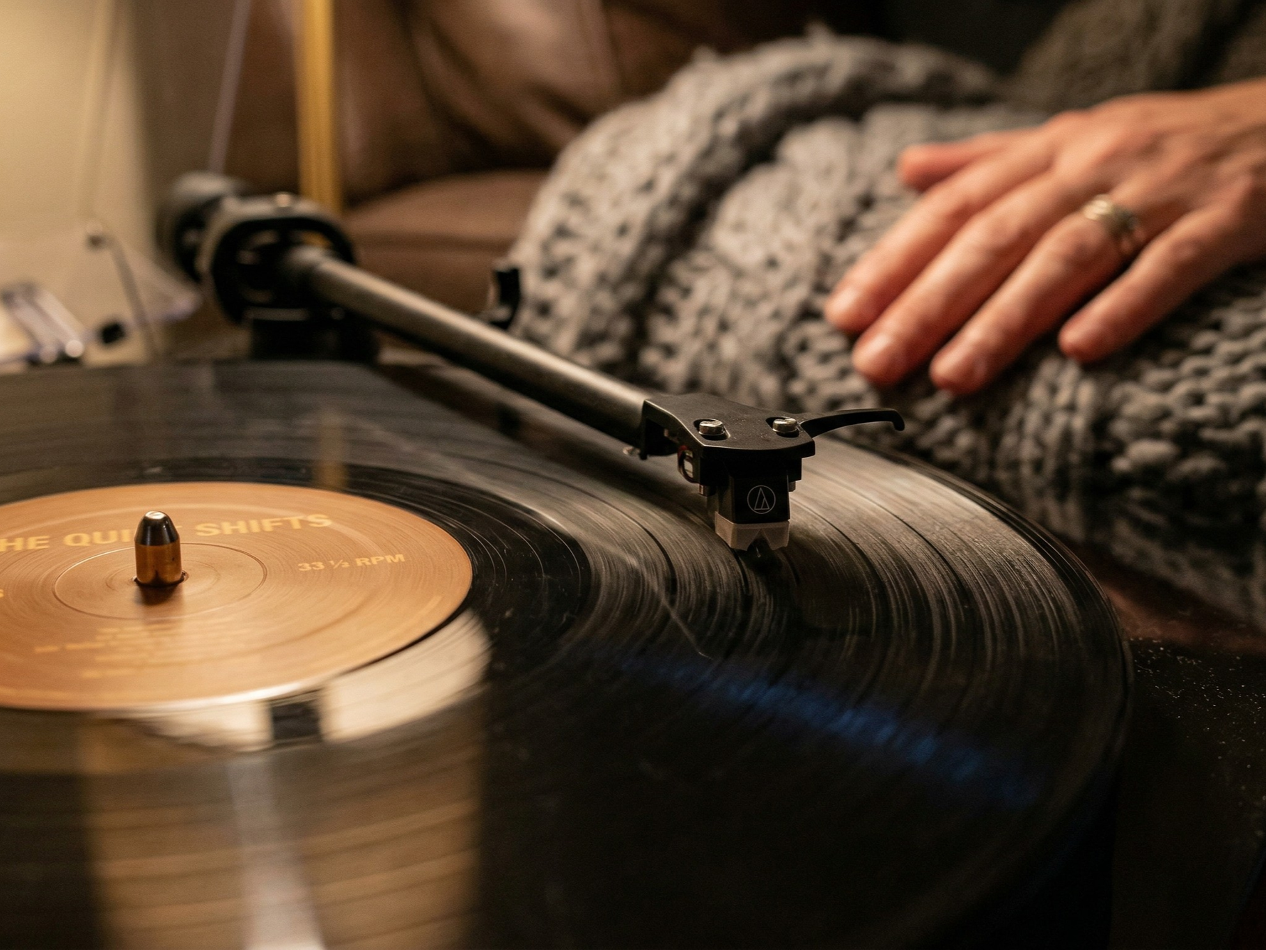 Close up of a spinning vinyl record, symbolizing the grounding power of rhythmic music used in trauma and anxiety therapy across IL and NC.