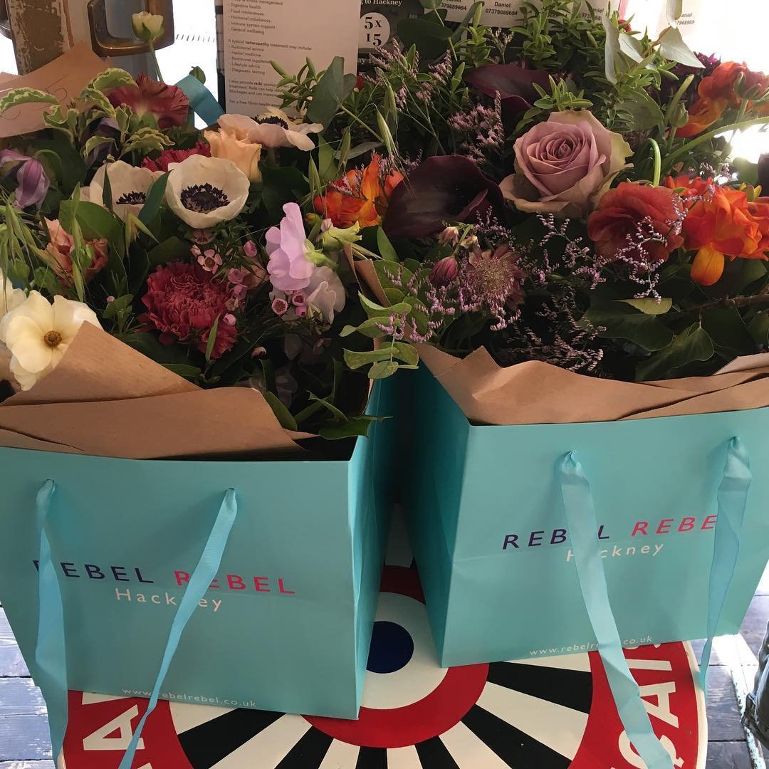 Flowers to go at our neighborhood cafe in London. Do we have to leave?