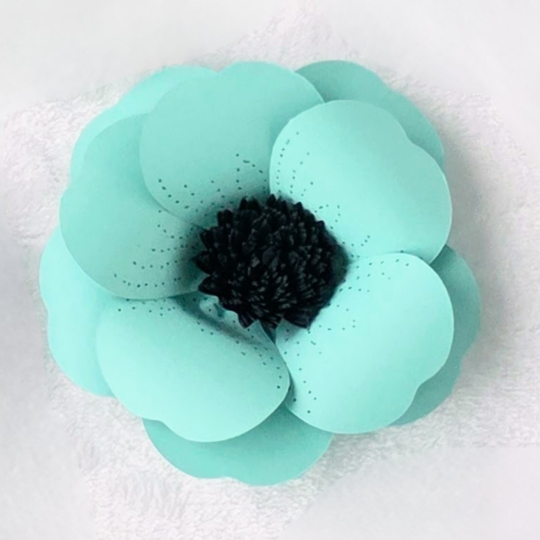 TURQUOISE BLACK CENTER PAPER FLOWER.png