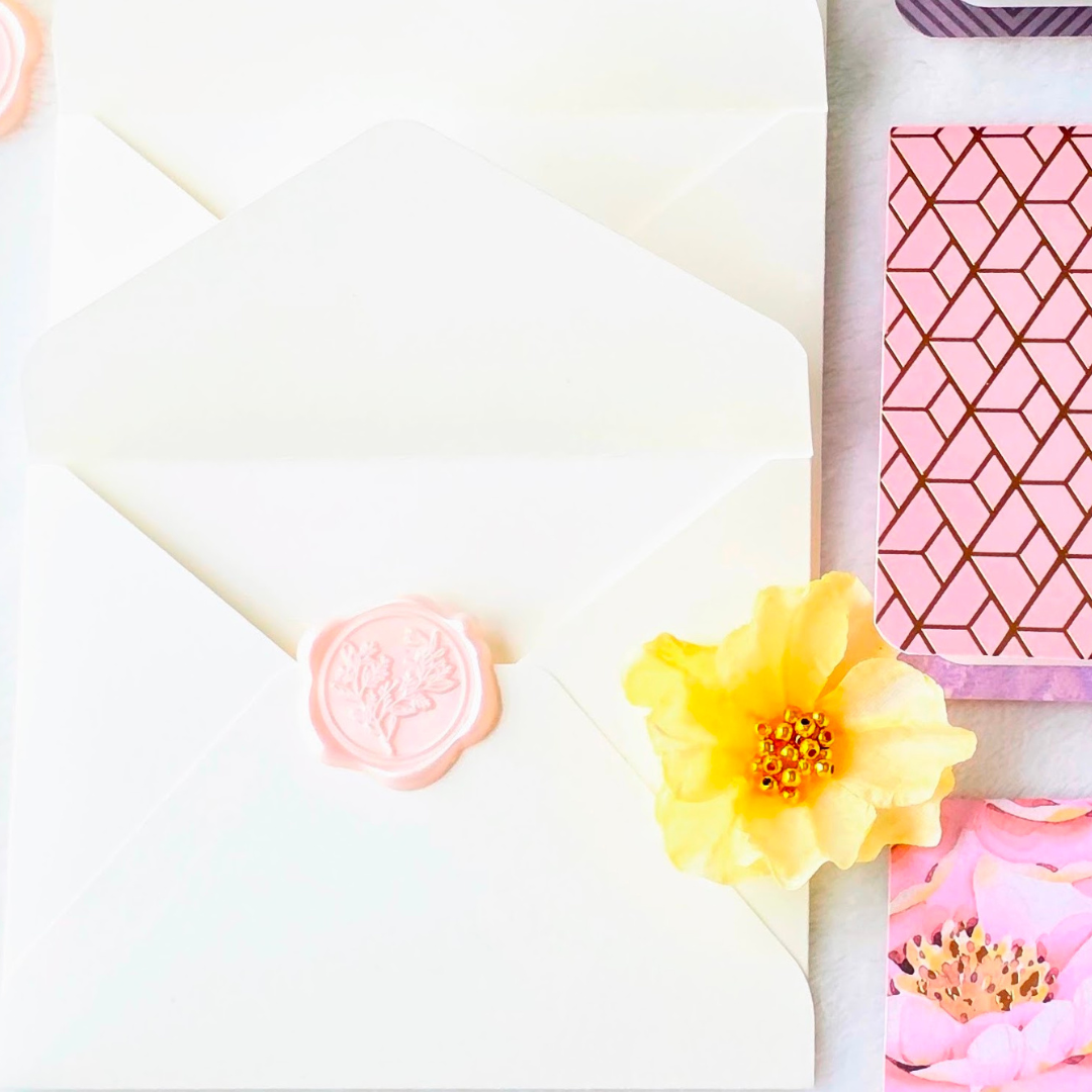 Off white envelope with Powder pink wax seal.png