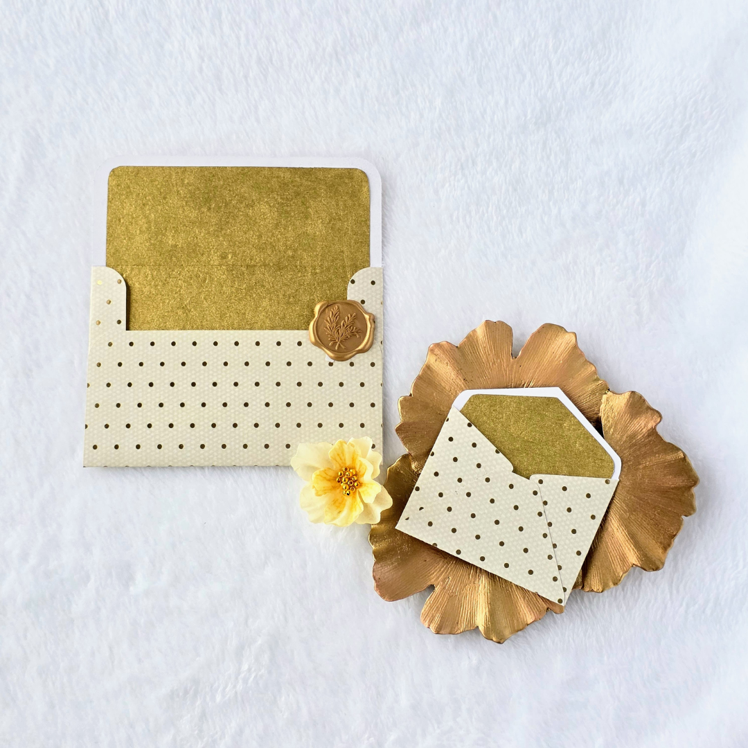 Ivory & Gold Polka Dot Envelopes gold wax seal.png
