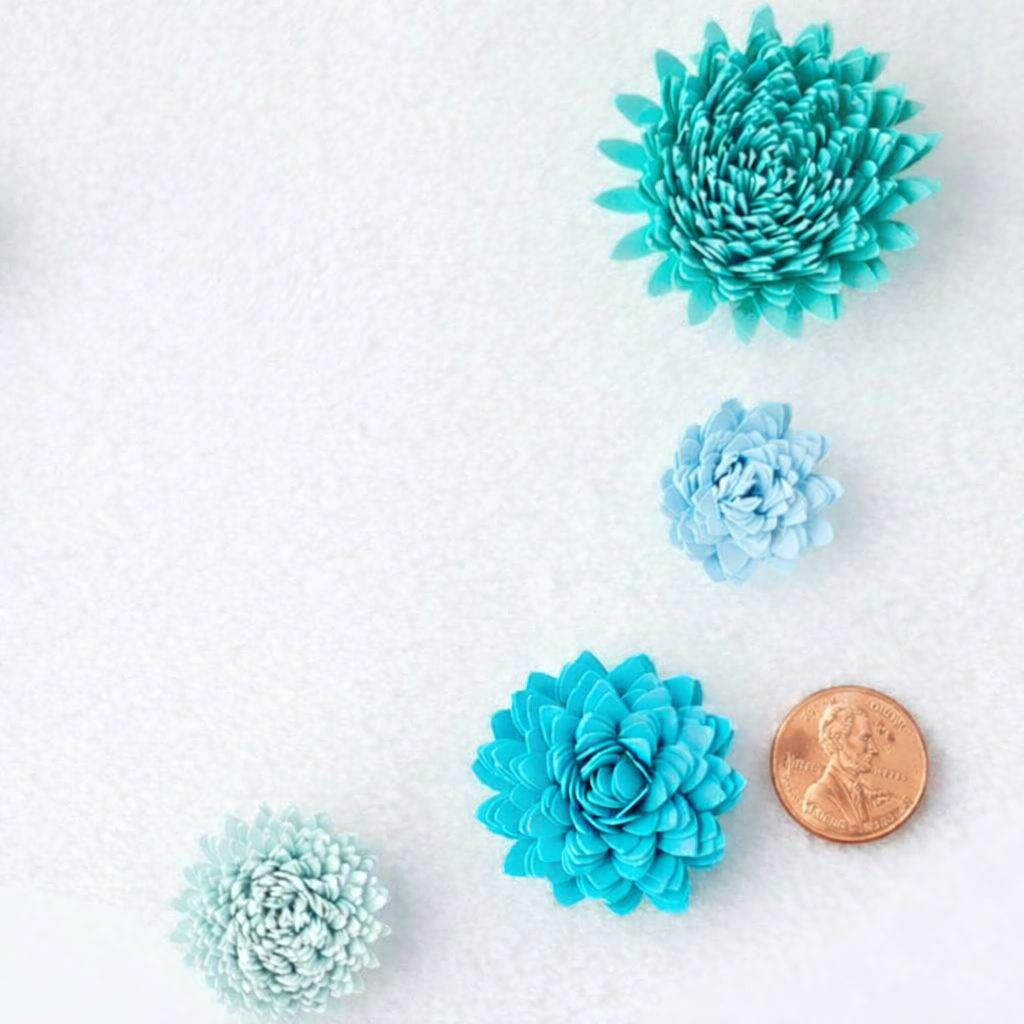 TURQUIOSE MINIATURE SPIKED PAPER FLOWERS WITH PENNY.png