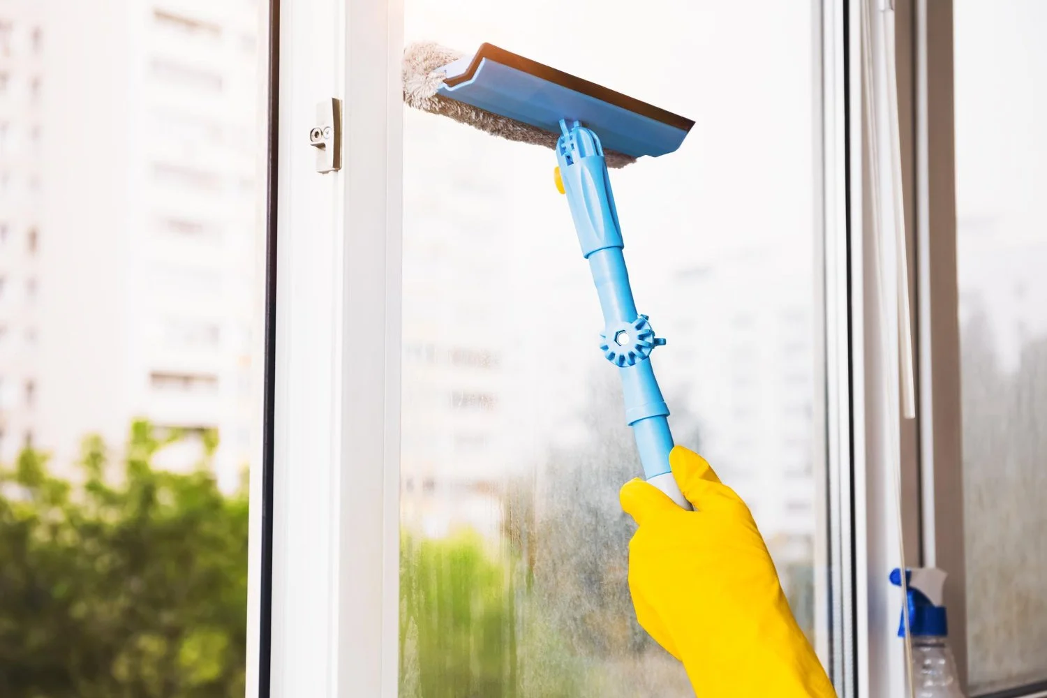 man-yellow-gloves-cleaning-window-with-squeegee-spray-detergent-home-terrace-house-cleaning-house-chores-domestic-hygiene-window-cleaning-background-with-blue-sky.jpg