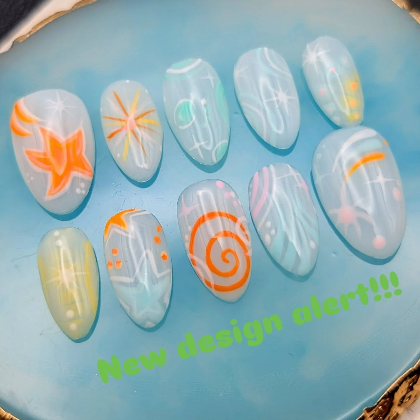 A new fresh design full of whirls and whimsy 🌀💫🫧

This set has such a dreamy, ethereal feel. Soft pastels, floating swirls, stars, and cosmic details with pops of neon.  Available NOW, link in my bio &hearts;️

#WhimsicalNails #CelestialNails #Cos