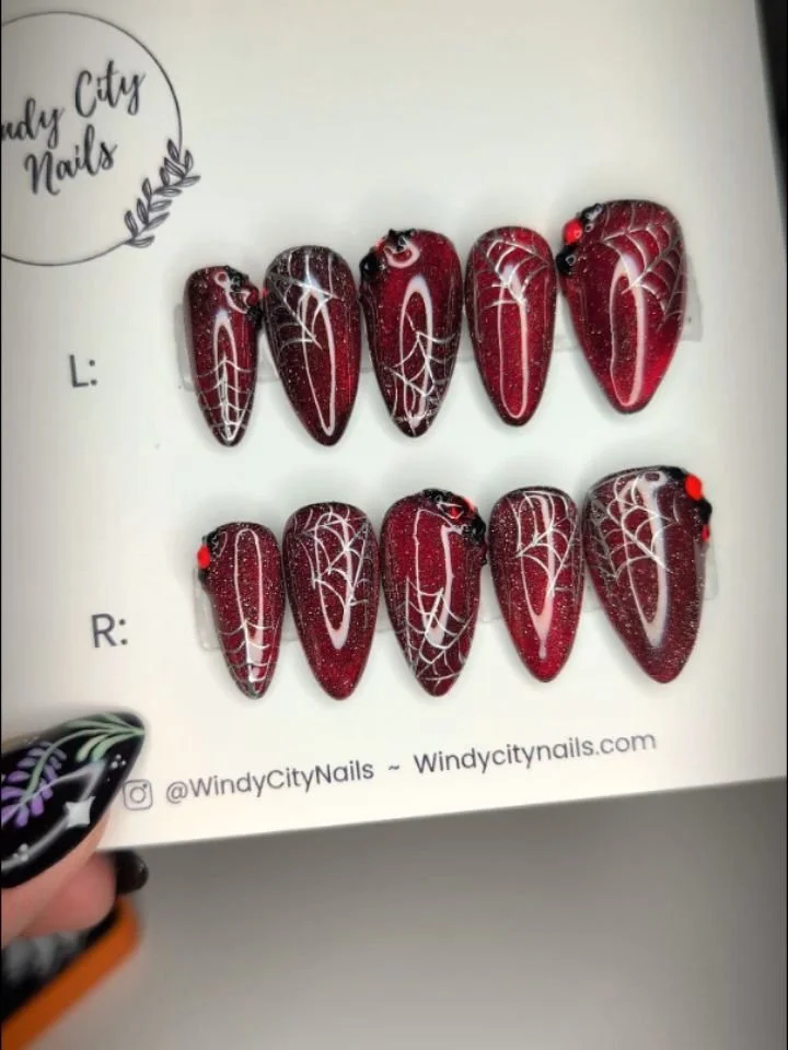 Spooky season nails are HERE!!! Ready for yours? DM me with inspo or head over to the 🔗 in my bio.  Get your orders in to have them on by Halloween! 

I am drooling over these vampy stilettos with silver chrome webs. I used a jelly red over a cat ey