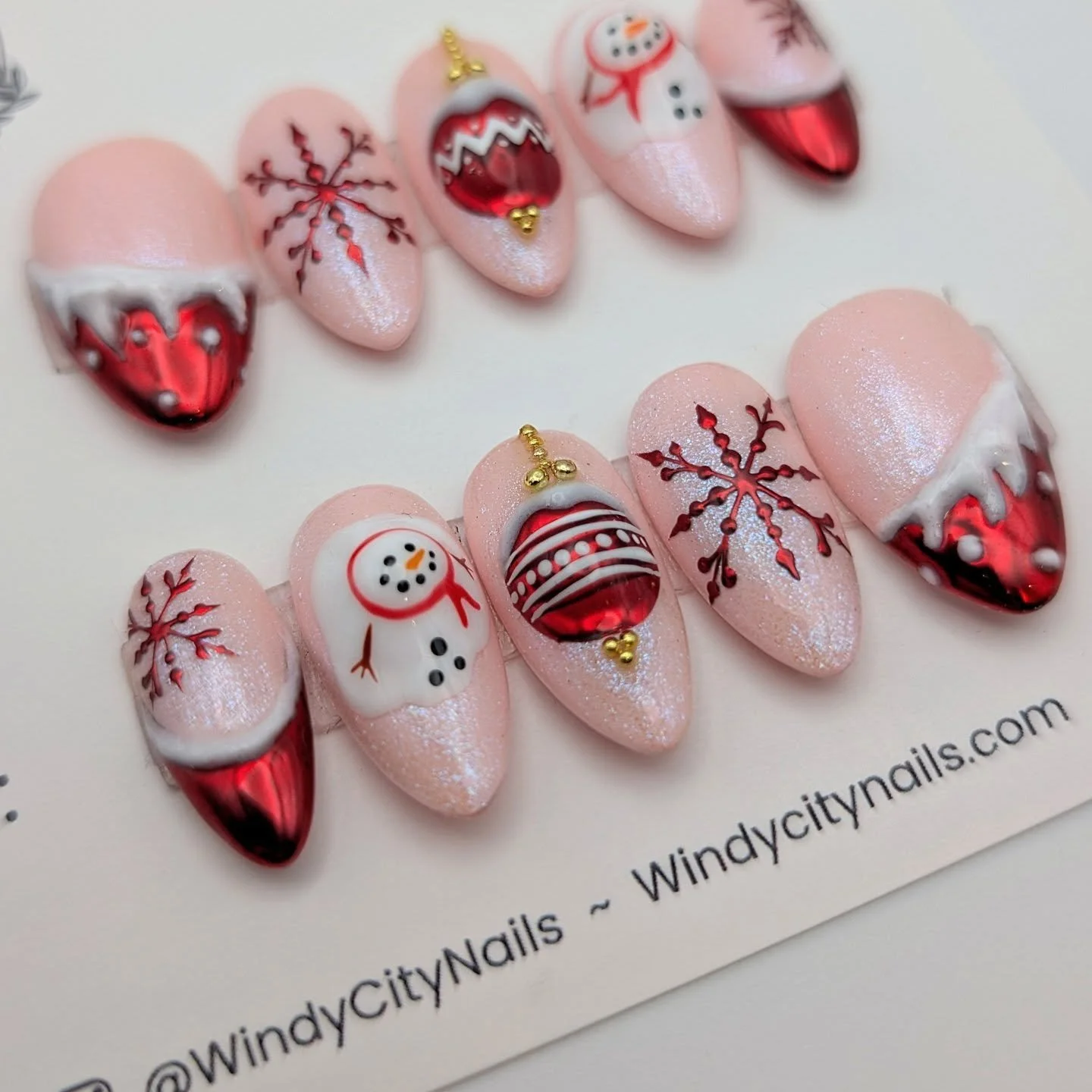 Get ready to 'sleigh' the holiday season with the perfect accessory, a stunning set of nails! 🎄🎁 Order the Holiday Cheer set now and get it in time for Christmas. 

The gorgeous red chrome and shimmery pink combo is sure to impress at any holiday g