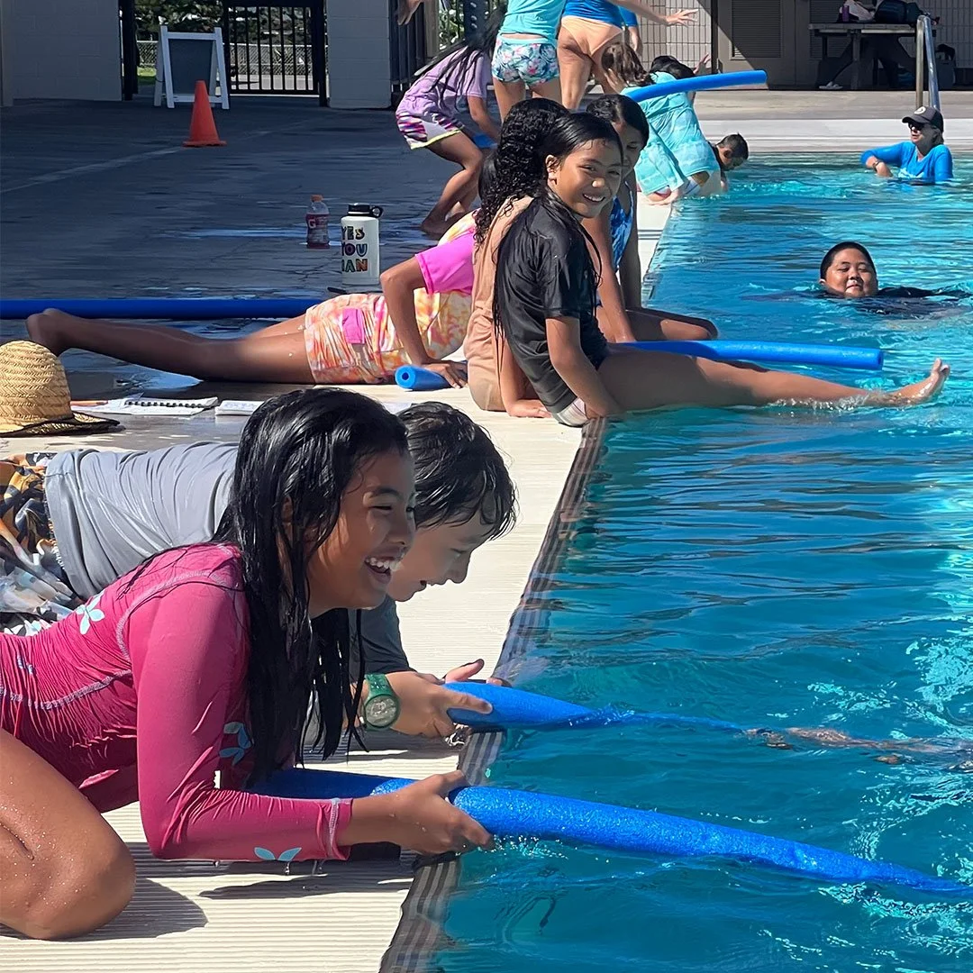 A group of middle school students learn about aquatic safety at a local community pool in Hawaii
