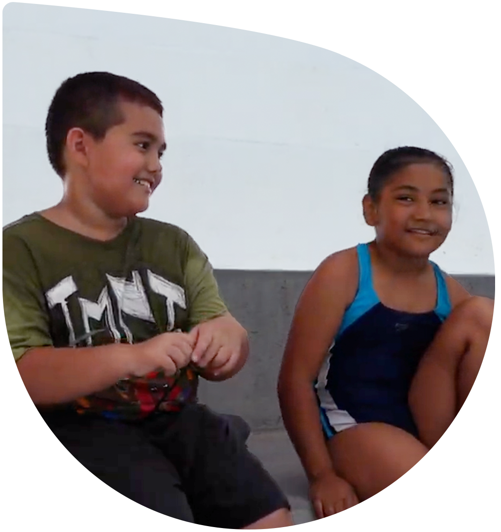 Two Siblings having fun learning about aquatic safety while attending a local elementary school on Oahu