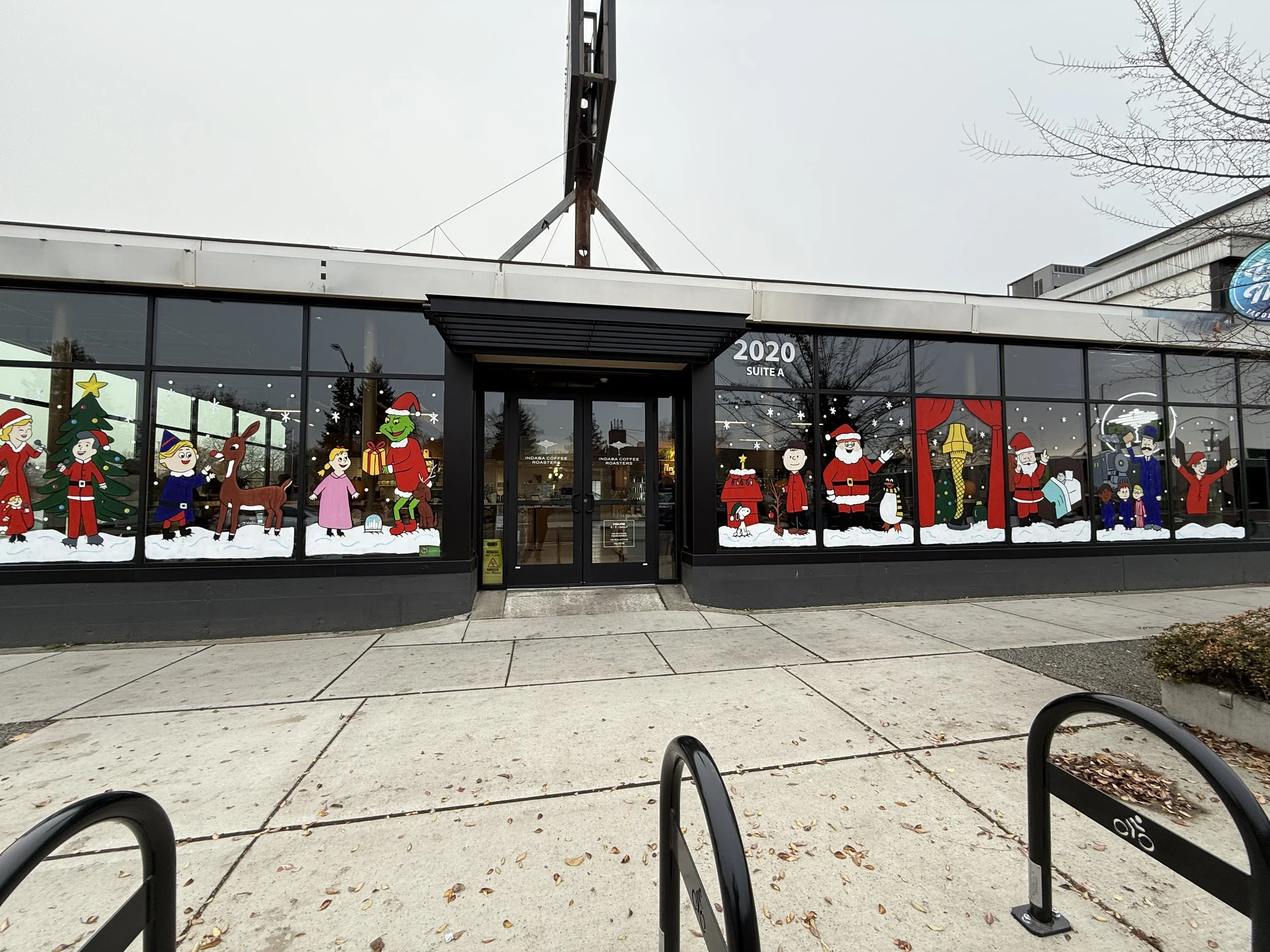 Classic Christmas movie scenes at Indaba Coffee for the Merry on Monroe window painting competition