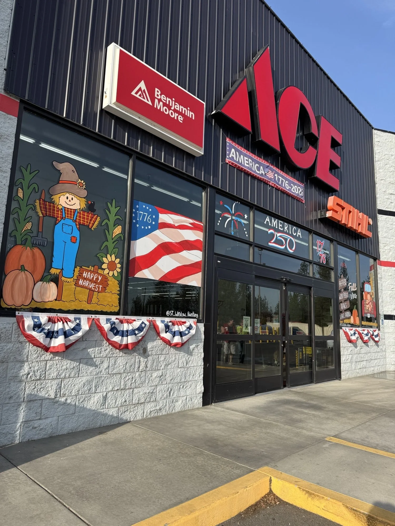 Fall vibes including a scarecrow, pumpkins, red truck, for fall at Ace Hardware.