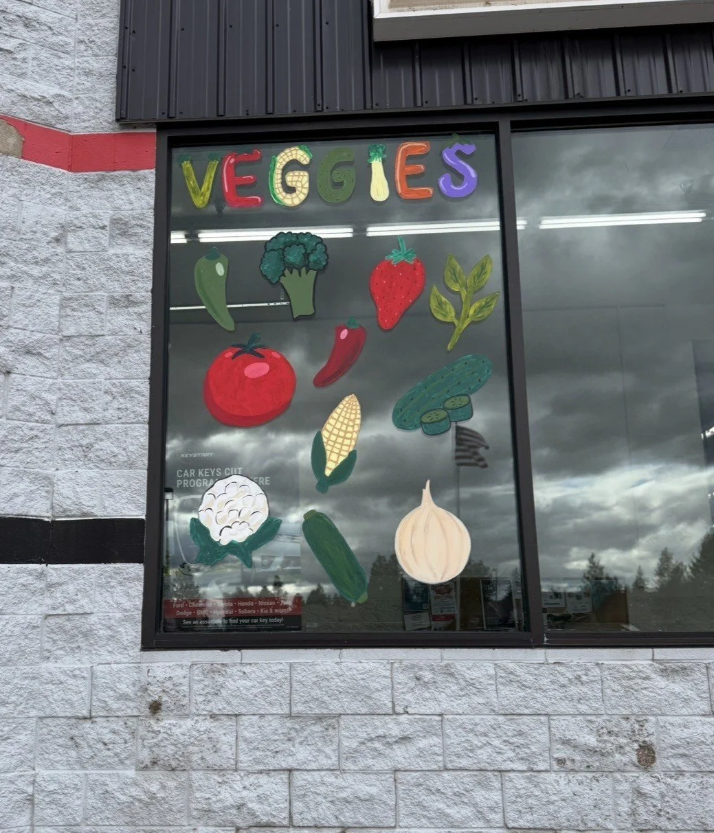 A large building with a theatrical-themed mural on the front and side windows. The mural includes text that says, "When God Goes to the Movies," along with illustrations of iconic movie props such as swords, popcorn, a film clapperboard, Darth Vader, Baby Yoda, Hermione Granger, lightning bolt, the sun, and a flaming torch. The start date, September 21, is also displayed.