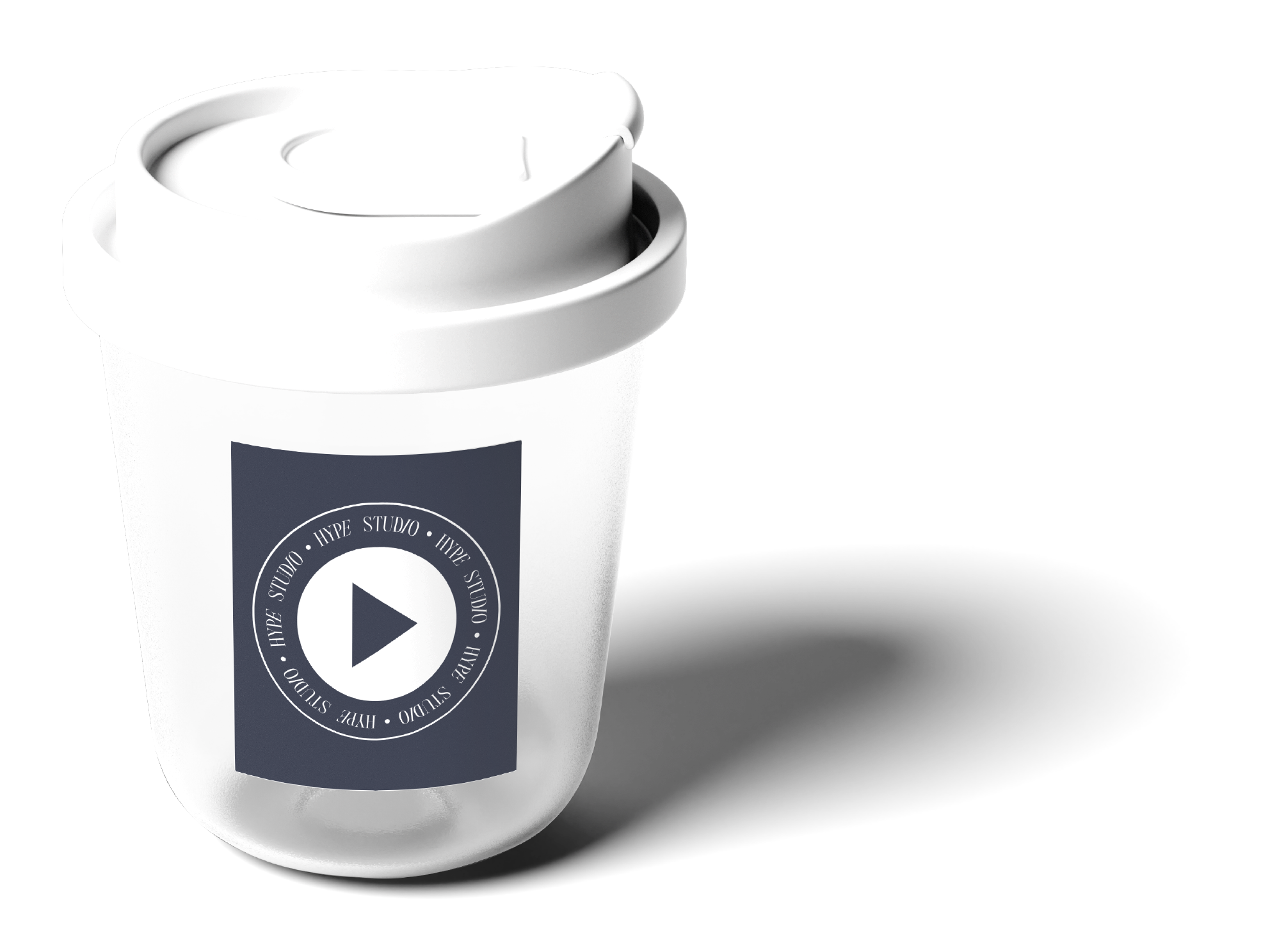 White disposable coffee cup with a black label featuring a circular logo with a play button in the center and the words 'HYPE STUDIO' repeated around the circle, casting a shadow to the right.