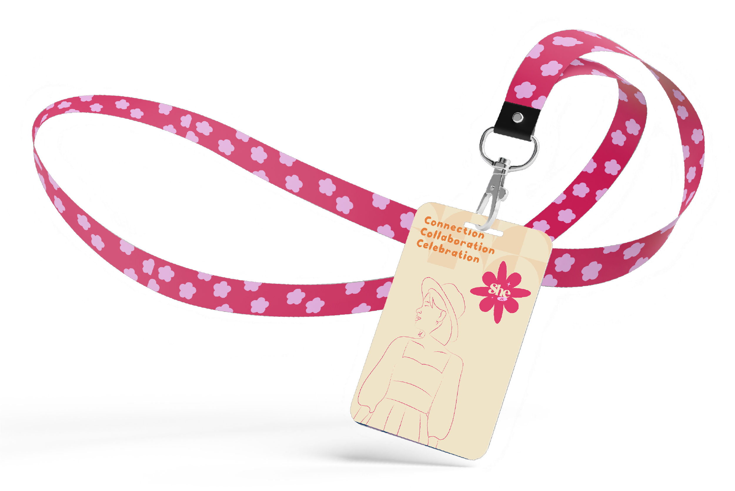 Pink lanyard with white flower patterns and a badge holder featuring a drawing of a woman with short hair, a hat, and a jacket, with words 'Connection Collaboration Celebration' and a pink flower logo with the word 'She' inside.