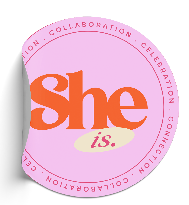 Pink circular sticker with the word 'she' in large orange letters and 'is.' in smaller pink letters on a cream-colored oval background. Surrounding the circle is a pink border with the words 'COLLABORATION,' 'CELEBRATION,' and 'CONNECTION' separated by dots.