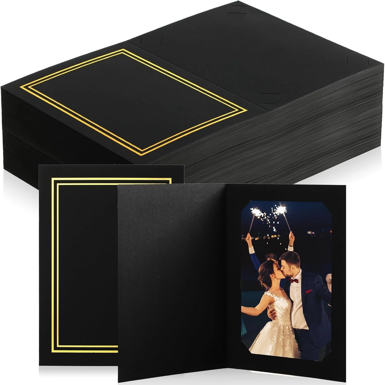 A wedding photo album with a picture of a bride and groom holding sparklers during their celebration, set against a dark background.