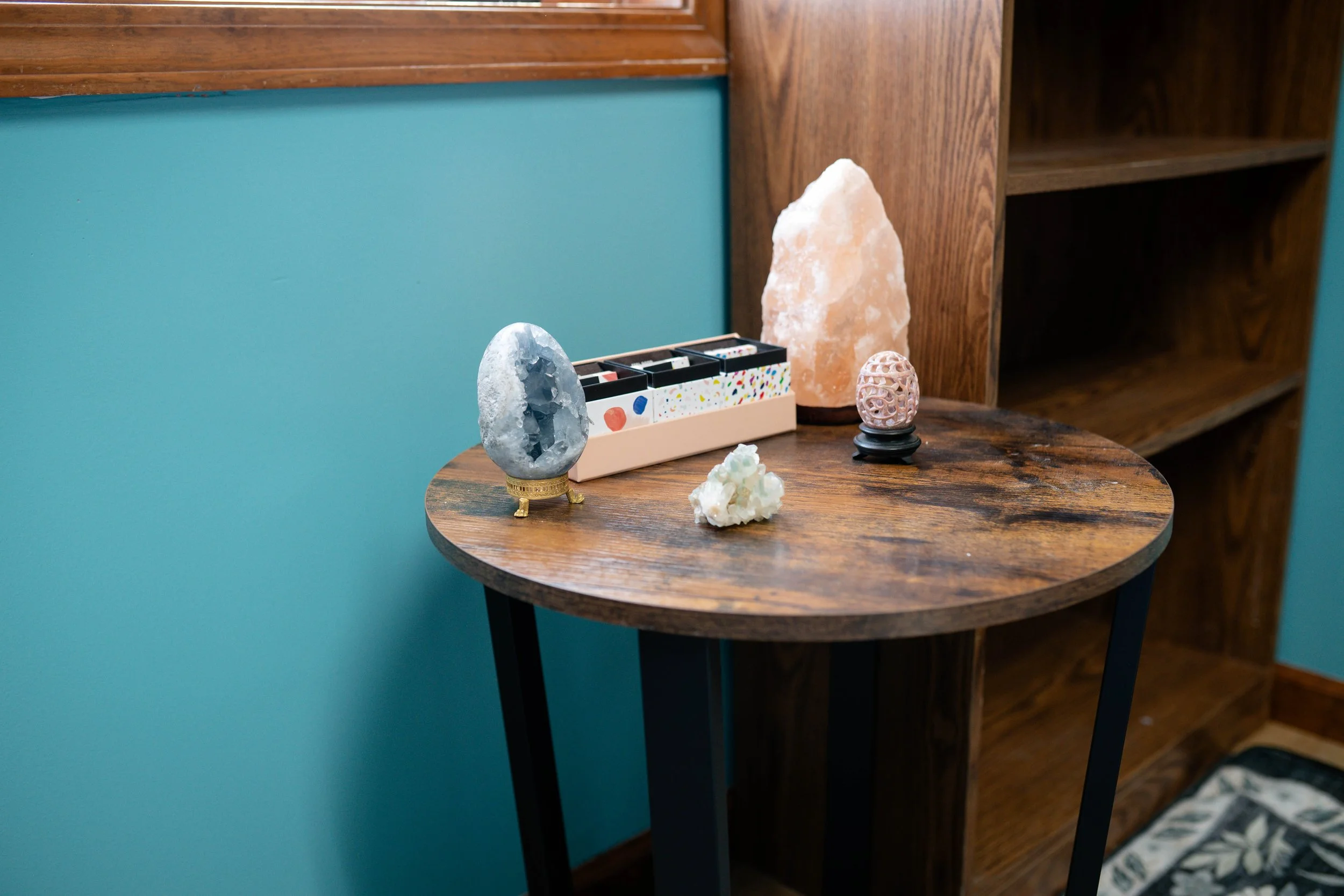 Calming décor in a furnished therapy office at MindSpace Collective, creating a relaxing environment for counseling and wellness sessions in Bloomington.