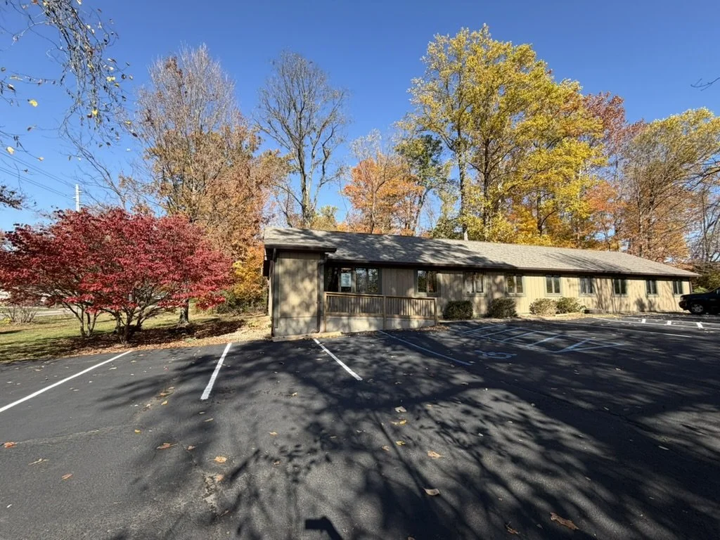 MindSpace Collective building exterior in Bloomington, Indiana with on-site parking for private offices and therapy space rentals.