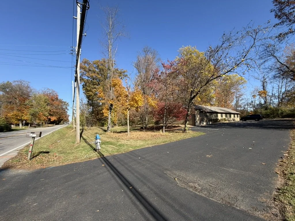MindSpace Collective building exterior in Bloomington, Indiana with on-site parking for private offices and therapy space rentals.