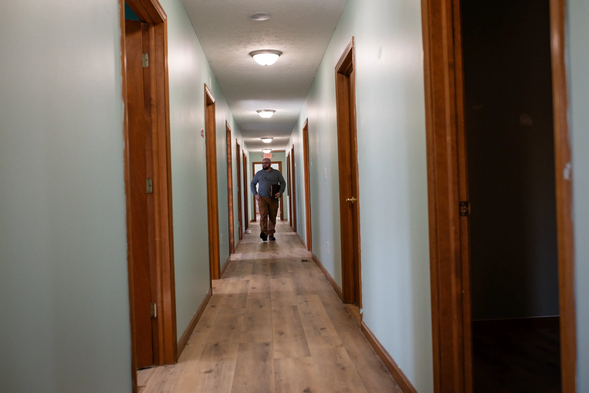 Professional hallway at MindSpace Collective in Bloomington leading to private therapy offices and flexible workspaces for rent.