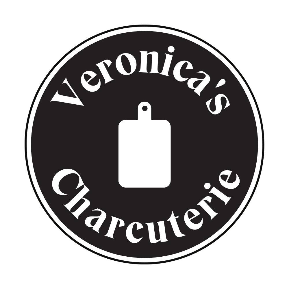 Circular logo with a black background and white text that reads 'Veroica's Charcuterie' surrounding a white silhouette of a cutting board.