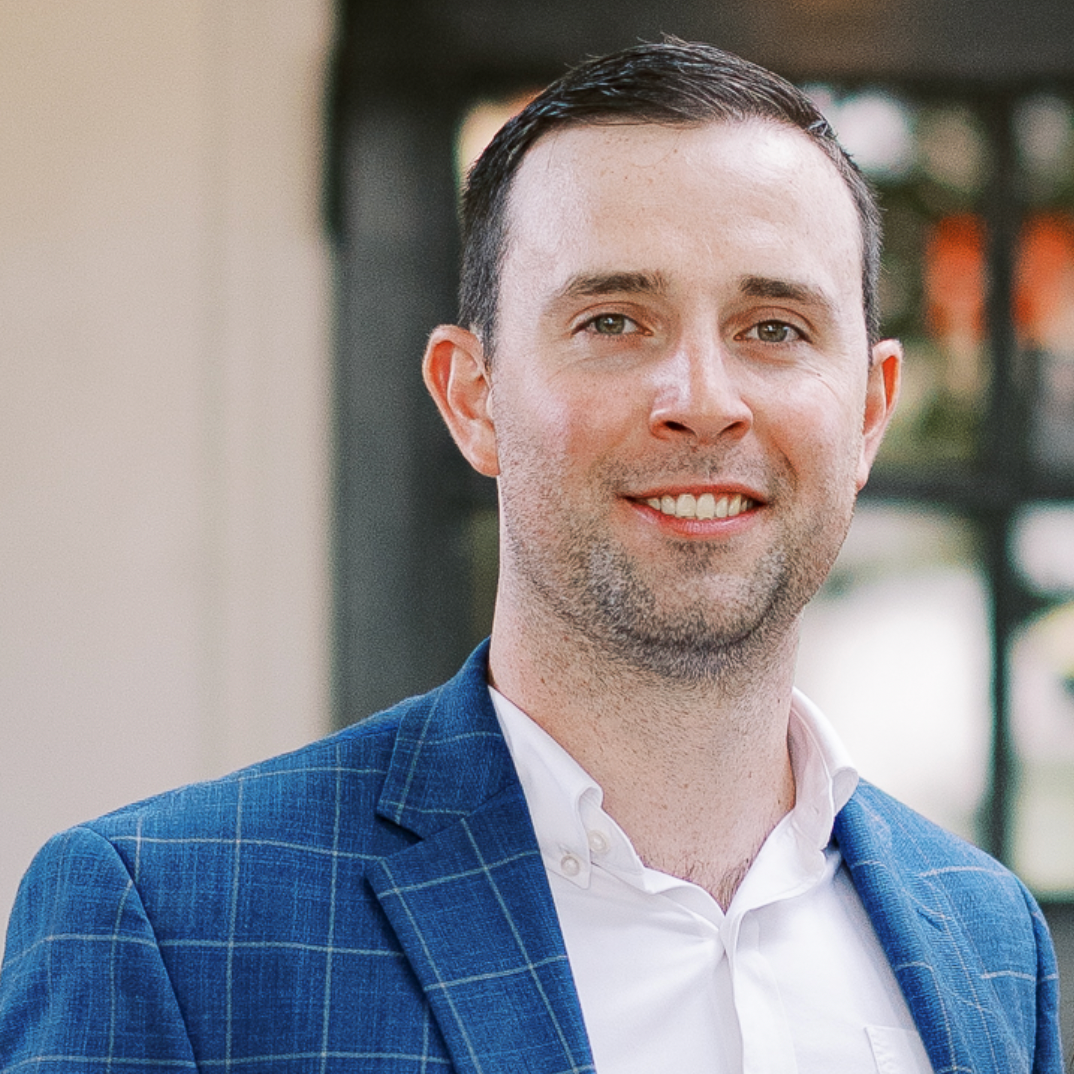 Headshot of James Virgil, Founder of Raleigh Spanish Center, smiling and wearing a blue blazer.