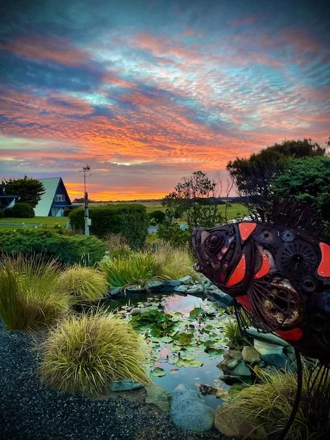 KI sunset and sculpture.jpeg