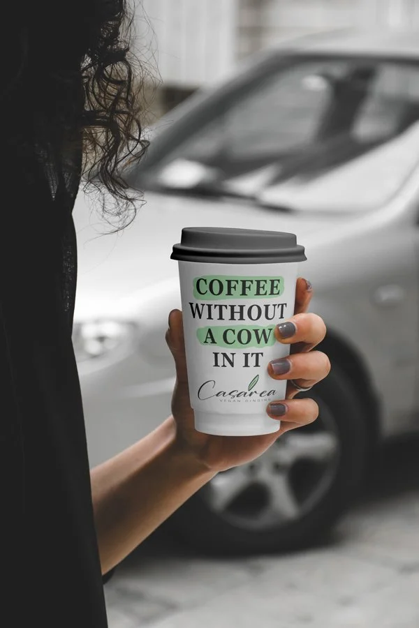 Woman-Holding-Cafe-Cup-Mockup.jpg