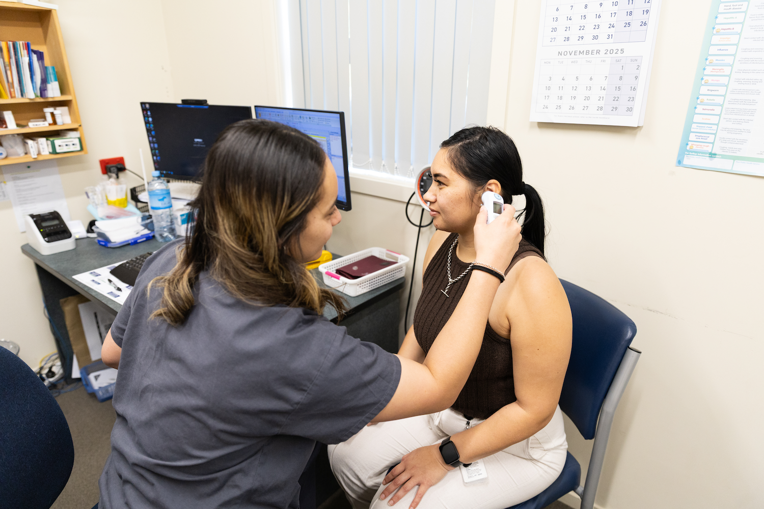 One of our health care assistants supporting patient care through routine temperature assessments at Te Wairoa Medical Centre.