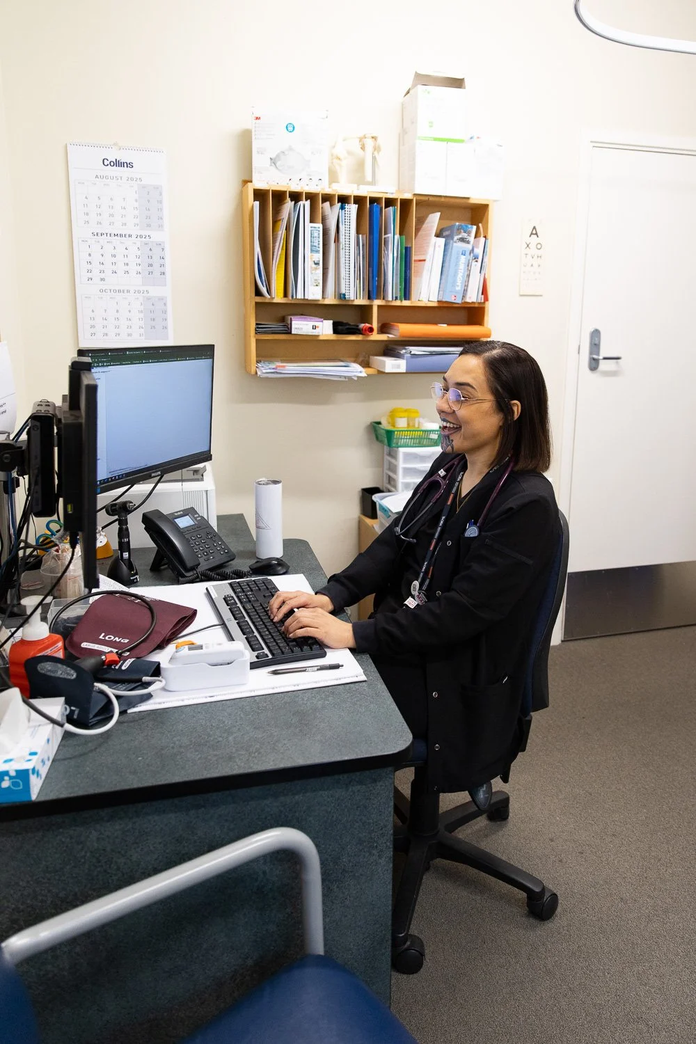 Dr Mania Cambbell-Seymour entering patient notes after a medical consultation at the clinic.