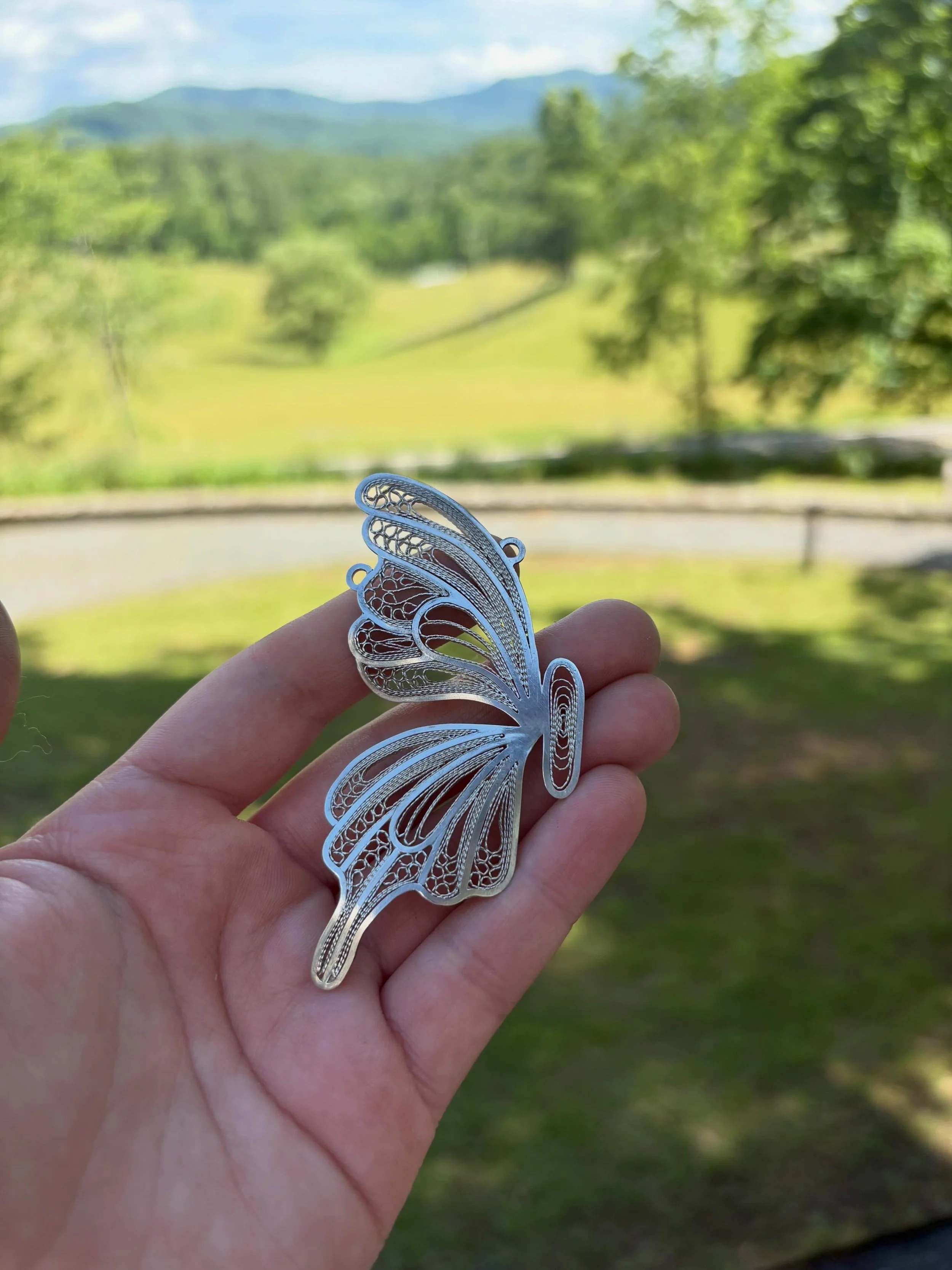 One last shot of all the pretty finished things that the talented Penland (short!) session one upper metals students made last week!! They made the frames, the twisted filler wires, inserted all the filler wires by hand and soldered them, some added 