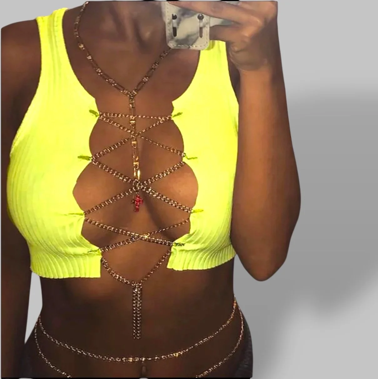 Yellow sleeve less boobs and chain.jpeg