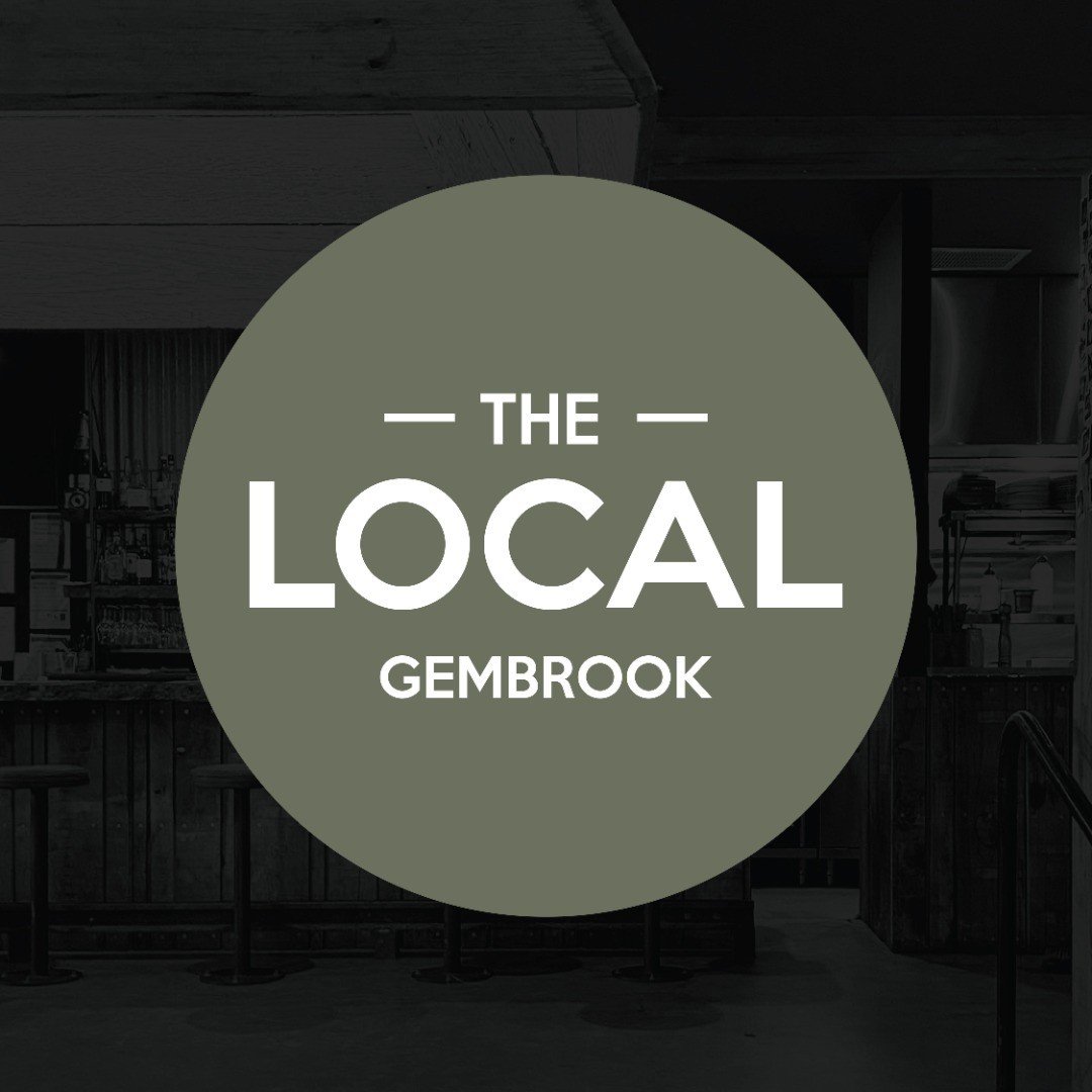 Logo for The Local Gembrook, with a dark background of a rustic restaurant or café interior.