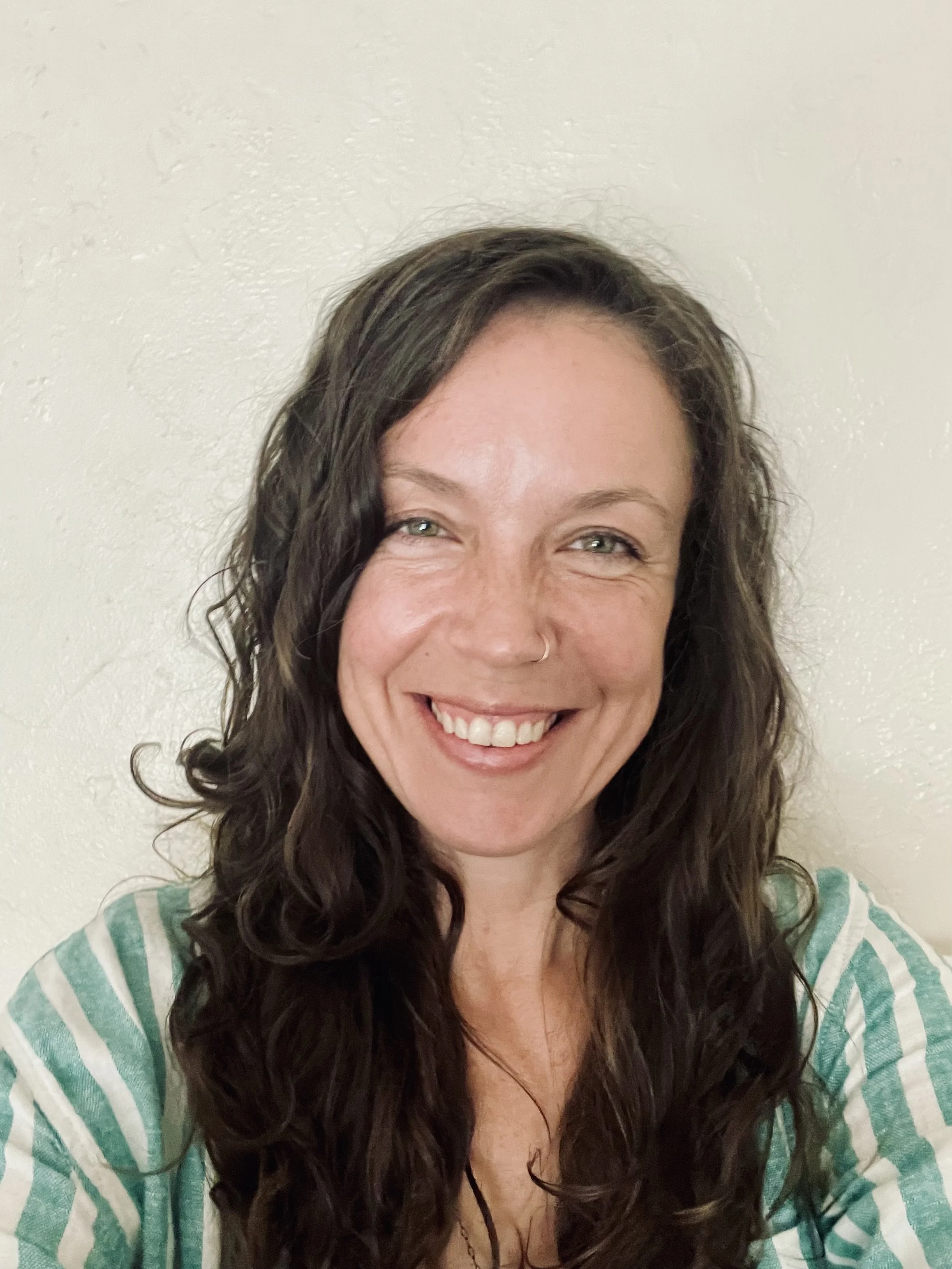 A smiling photo of Monica K. Robinson, founder of Emerald Eye Communications, a social media marketing service for Humboldt County, CA small businesses.