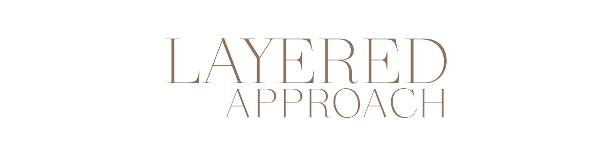 Text on a black background that says "LAYERED APPROACH" in large beige letters.