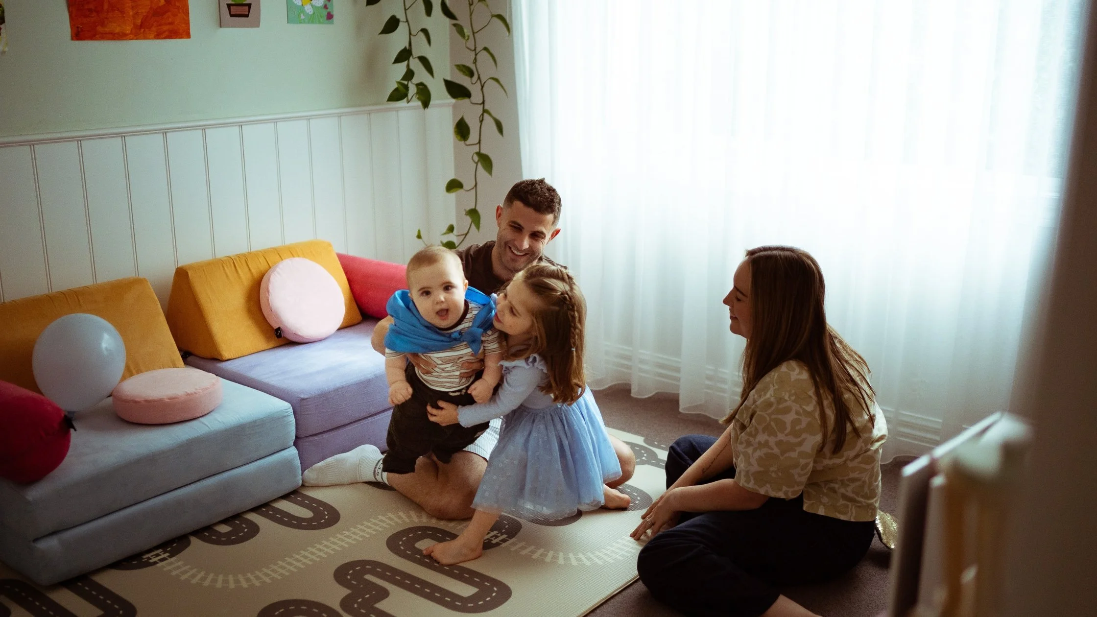 At-home family session Macedon Ranges — family playing together in living room