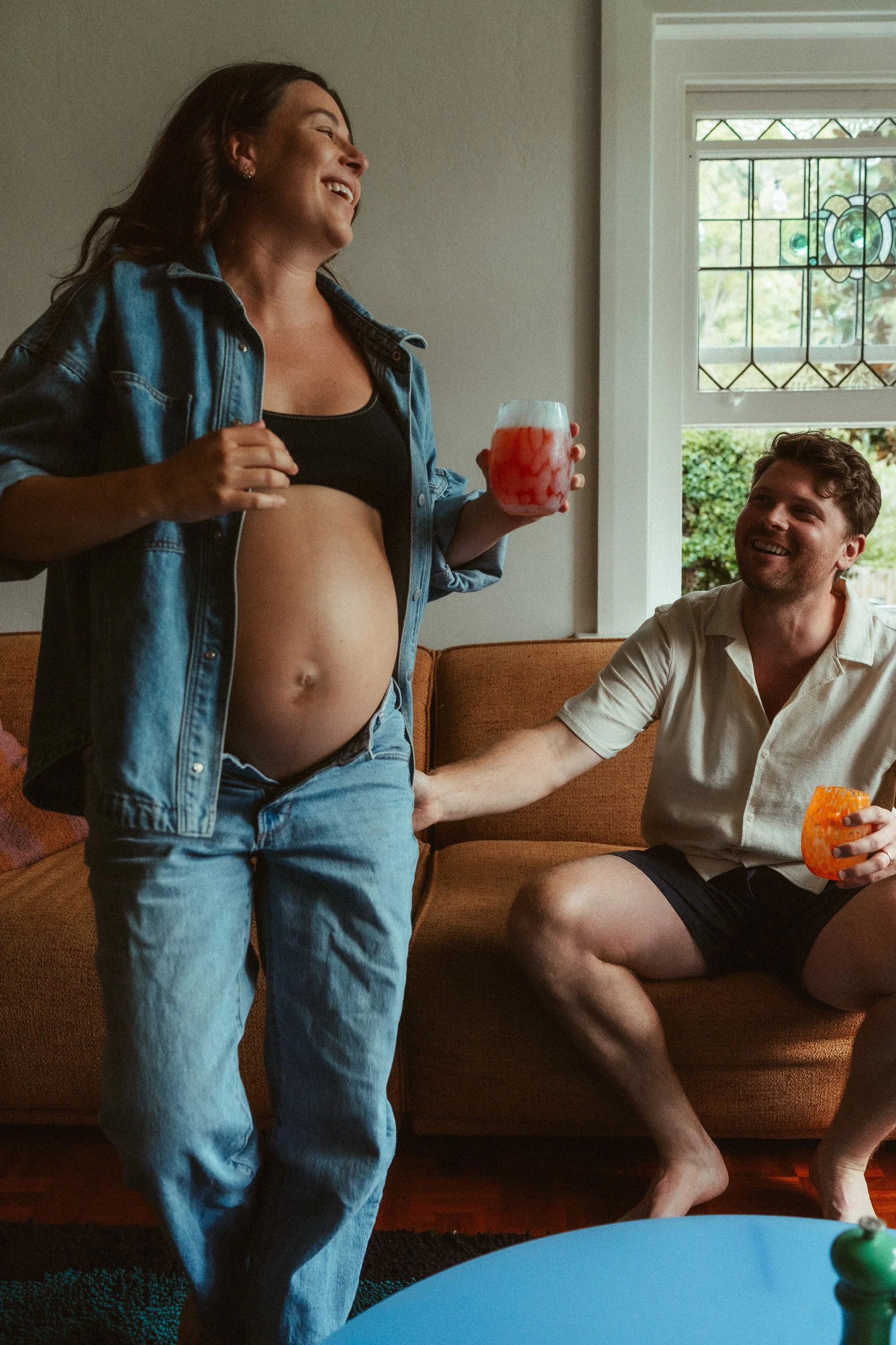 Maternity photographing lounging sofa couple in Melbourne, Australia
